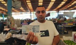 Adana pazarında gizemli aşk ilanı: Üzeri yazılı paralar şehri ayağa kaldırdı